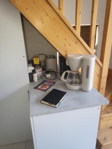 a counter with a coffee maker and a mixer on it at La Maison Defanny - 2 in Muides-sur-Loire