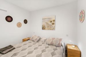 a bedroom with a bed and a picture on the wall at Daniel House in Mogán +12 photos