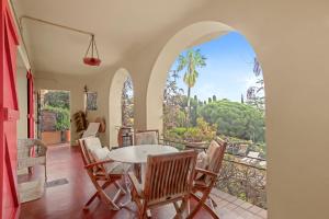 a dining room with a table and chairs at Villa Les Dauphins in Le Lavandou