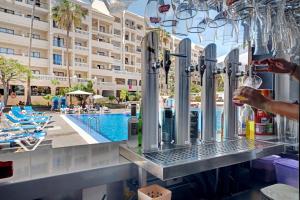 a bar at the pool at the resort at Castle Harbour in Los Cristianos