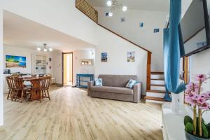 a living room with a couch and a table at Villa Elena in Castelsardo
