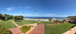 a swimming pool with the ocean in the background at Villa Elena in Castelsardo