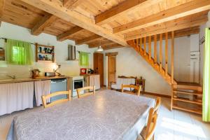 a kitchen and dining room with a table and chairs at La Petite Palasse in Le Thor +16 photos
