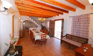 a dining room with a table and chairs at Can Palea in Campos