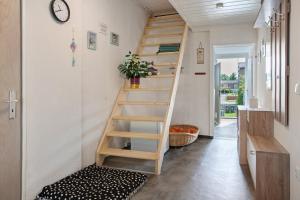a staircase in a tiny house with a bench at Wanderpfoten Ostsee Ferienhaus in Tribsees