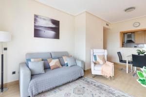 a living room with a couch and a table at Golf And Sun in Los Alcázares