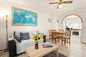 a living room with a couch and a table at Casa Coral Beach in Málaga