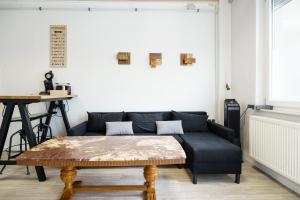 a living room with a couch and a table at Apartment 19 in Schutterwald