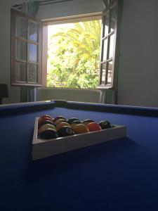 a pool table with a box of balls on it at Casa Paula in Yaiza