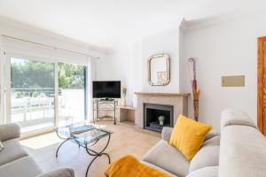 a living room with a couch and a fireplace at Apartamento Minerva in Alcudia
