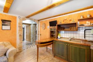 a kitchen with a sink and a counter at Appartamento Padola 72 in Padola +16 photos