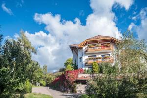 a building with balconies on the side of a road at Residence Skutial App Schlern in Castelrotto