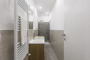 a bathroom with a sink and a shower at Casa Gioiosa Holidays in Gioiosa Marea +19 photos