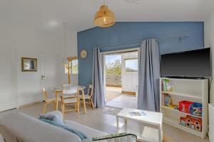 a living room with a couch and a table at Gite Bellevue in Paulin +20 photos