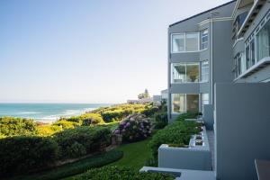 an apartment building with a view of the ocean at Bayview 104 in Hermanus
