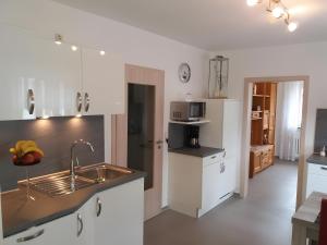 a kitchen with a sink and a counter top at Haus Maruna in Schauenburg