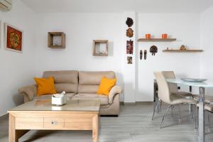 a living room with a couch and a table at Reina's in Vejer de la Frontera