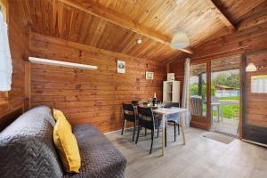 a living room with a couch and a table at Chalet confort 20 in Saint-Gervais