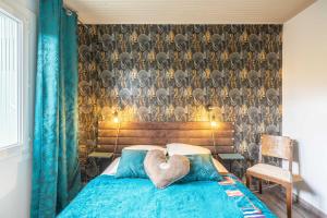 a bedroom with a bed with a heart pillow on it at Gite Du Porche Bis in Chaillevette
