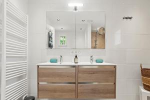 a bathroom with a sink and a mirror at La Petite Maison Jaune in Grimaud +32 photos