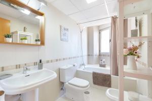 a bathroom with a sink and a toilet and a tub at Vivienda maiva in Alhama de Murcia +12 photos