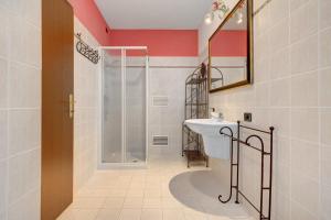 a bathroom with a shower and a sink at Katzemburg 9999 in Arco +35 photos