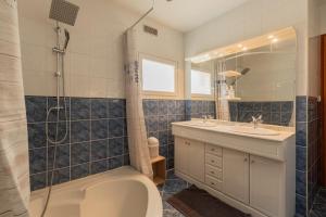 a bathroom with a shower and a toilet and a sink at Maison maxi 8 personnes, proche mer in Mers-les-Bains +20 photos