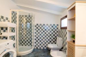 a bathroom with a shower and a toilet and a sink at Villetta Antonia in Marina di Andora +19 photos