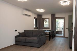 a living room with a couch and a table at Appartamenti Suly 5 - Cir 0086 in Saint Vincent