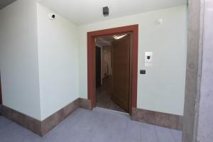 an empty hallway with a door in a building at Appartamenti Suly 5 - Cir 0086 in Saint Vincent