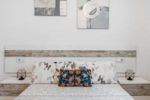 a bedroom with a bed with two pillows on it at Apartamento Centro de Marbella in Marbella