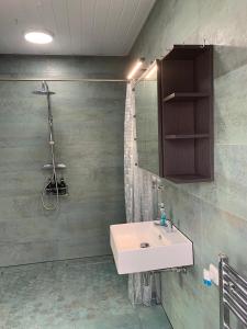 a bathroom with a sink and a mirror at Beach Bungalow in Torrox +15 photos