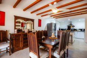 a dining room and kitchen with a table and chairs at Villa Carla in Port de Soller