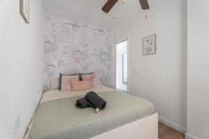a bedroom with a bed with a stuffed animal on it at Oasis del Sur in San Miguel de Abona +20 photos