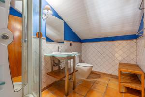 a bathroom with a toilet and a sink and a shower at The Maisonette Sierra Nevada in Monachil +26 photos