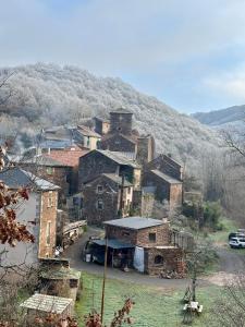 a large building on the side of a mountain at L’Angelina in Martrin