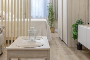 a table with a candle on it in a room at Apartamentos Brisas de Cádiz 3 in Cádiz