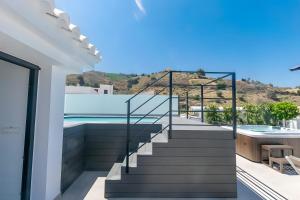 a staircase leading up to a house with a swimming pool at Stunning apartment in Cómpeta in Cómpeta +11 photos