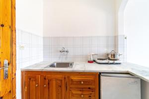 a kitchen with a sink and a counter top at Captain Spiros Studios 2 in Paleokastritsa