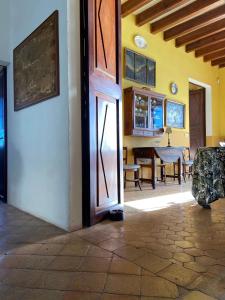 a room with an open door and a dining room at Casa vacacional Es Port in Portocolom