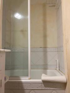 a bathroom with a shower and a bath tub at Casa vacacional Es Port in Portocolom +31 photos