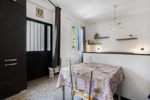 a room with a table and a black door at Casa Luigi in Vernazza +17 photos