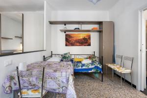 a bedroom with a bed and a mirror at Casa Luigi in Vernazza