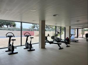 a gym with treadmills and ellipticals in a building at Samitier in Cambrils