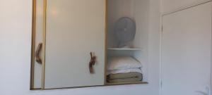 a medicine cabinet with a mirror in a bathroom at Guidon Fourchette et table d'hôtes in Saint-Bonnet-de-Salers +62 photos