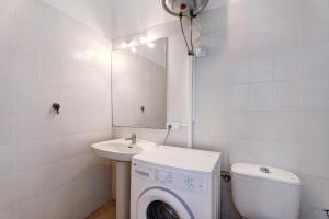 a bathroom with a washing machine and a sink at 418 Panoramic View Playa Paraiso in Adeje +15 photos