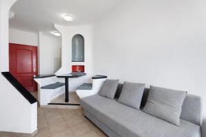 a living room with a couch and a table at 418 Panoramic View Playa Paraiso in Adeje