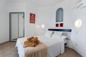 a bedroom with two beds with towels on a table at 418 Panoramic View Playa Paraiso in Adeje