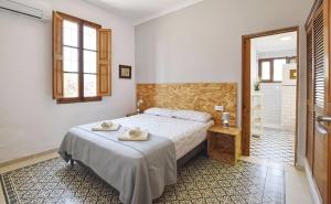 a bedroom with a bed with towels on it at Valls in Montuiri +16 photos