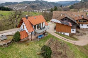 an overhead view of a house with an orange roof at Vorderbühlhof in Oppenau